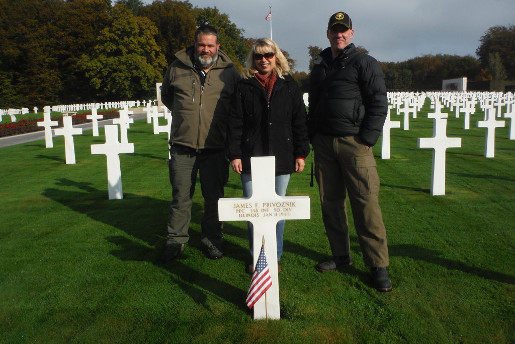 Tom Scholtes, Jennifer Holik, and Doug Mitchell at the grave of James Privoznik.